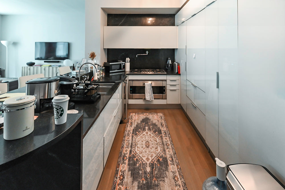 Cesar Modern Glossy White Kitchen with Black Granite Countertops & Appliances