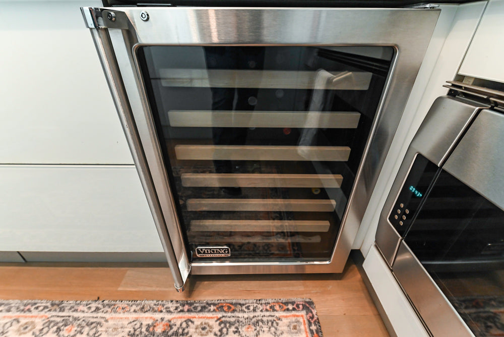 Cesar Modern Glossy White Kitchen with Black Granite Countertops & Appliances