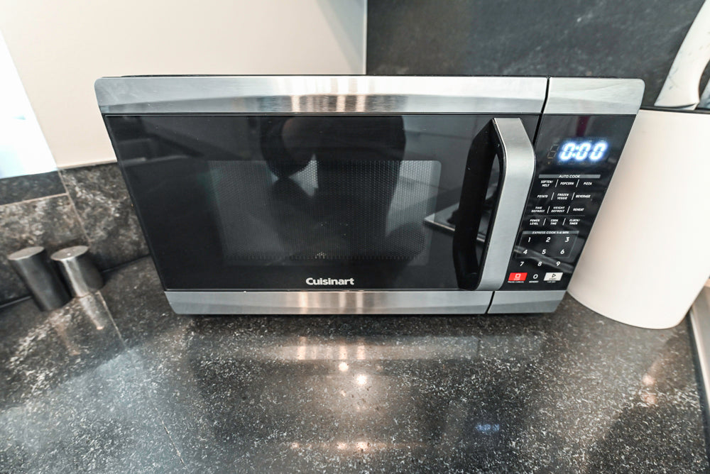 Cesar Modern Glossy White Kitchen with Black Granite Countertops & Appliances