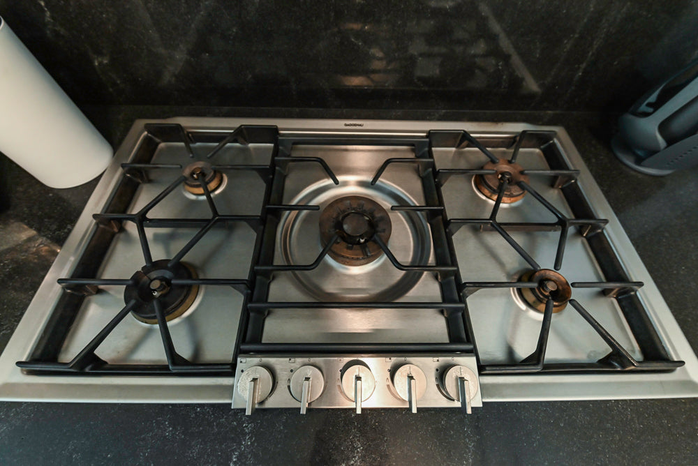 Cesar Modern Glossy White Kitchen with Black Granite Countertops & Appliances