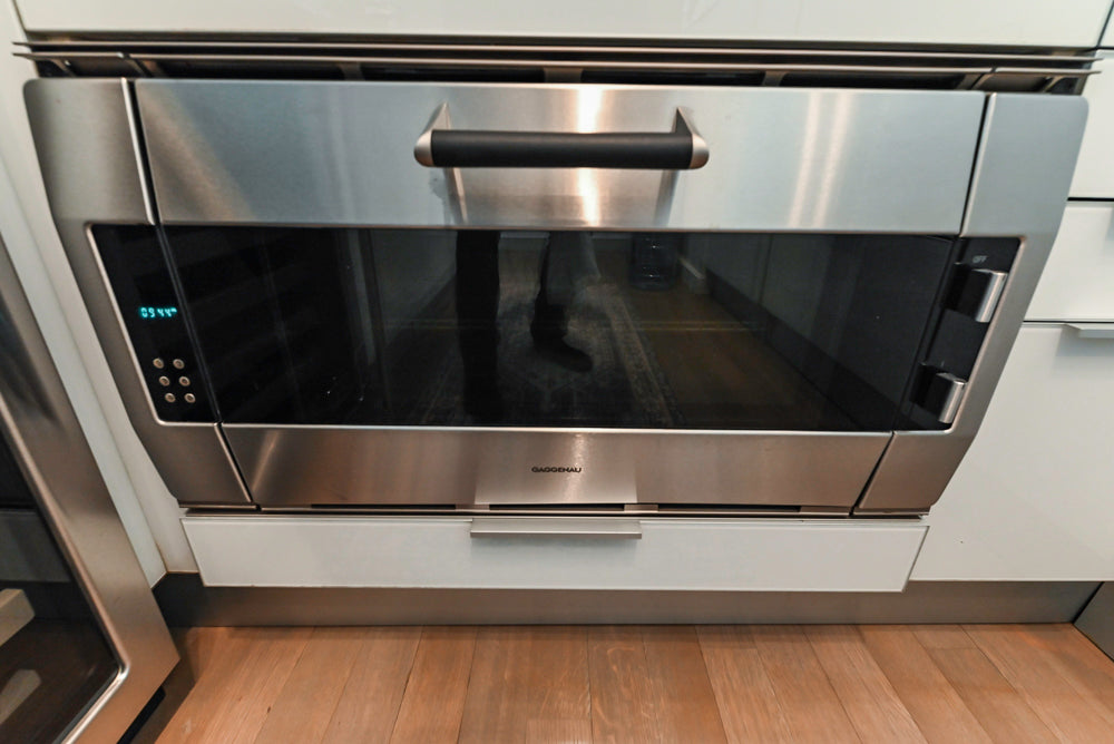 Cesar Modern Glossy White Kitchen with Black Granite Countertops & Appliances