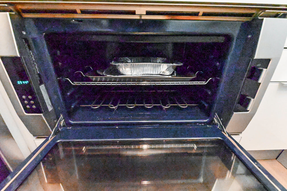 Cesar Modern Glossy White Kitchen with Black Granite Countertops & Appliances