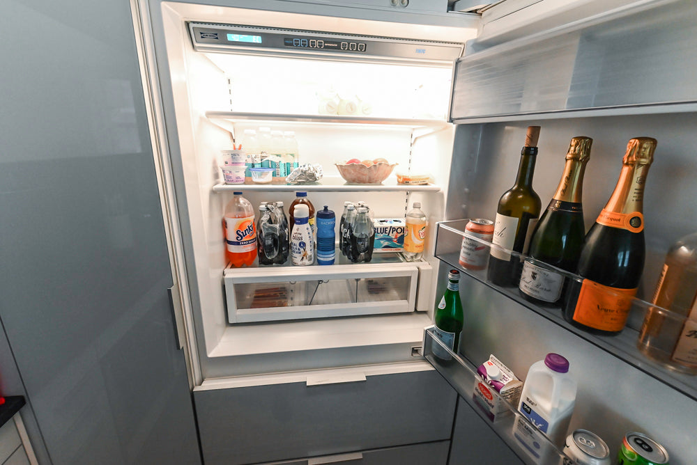 Cesar Modern Glossy White Kitchen with Black Granite Countertops & Appliances