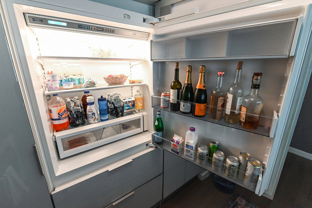 Cesar Modern Glossy White Kitchen with Black Granite Countertops & Appliances