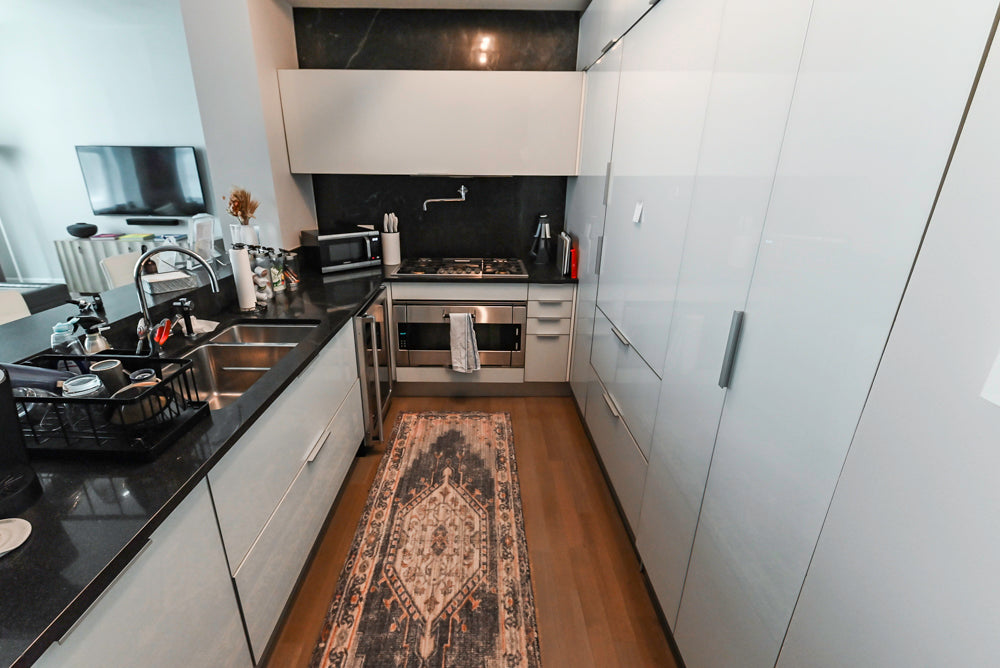 Cesar Modern Glossy White Kitchen with Black Granite Countertops & Appliances