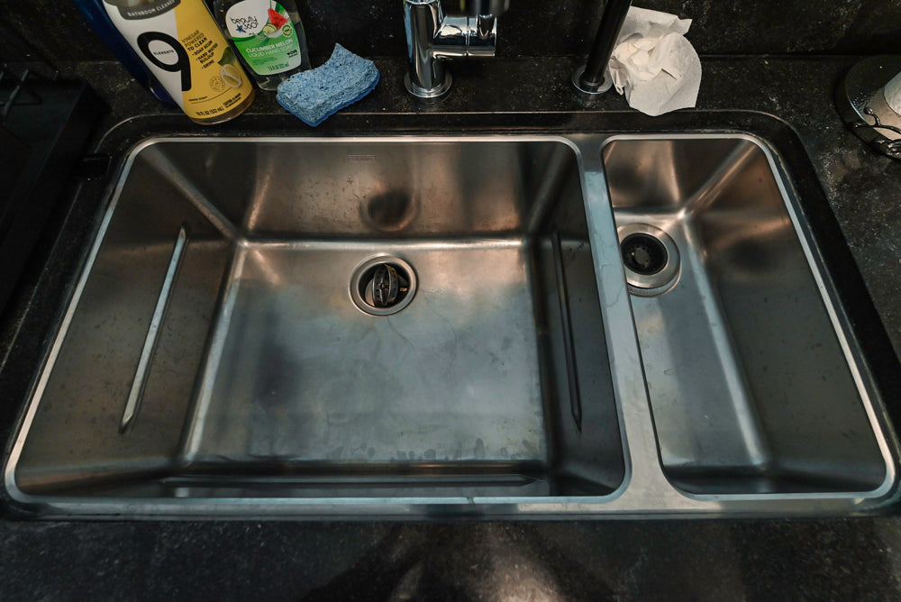 Cesar Modern Glossy White Kitchen with Black Granite Countertops & Appliances