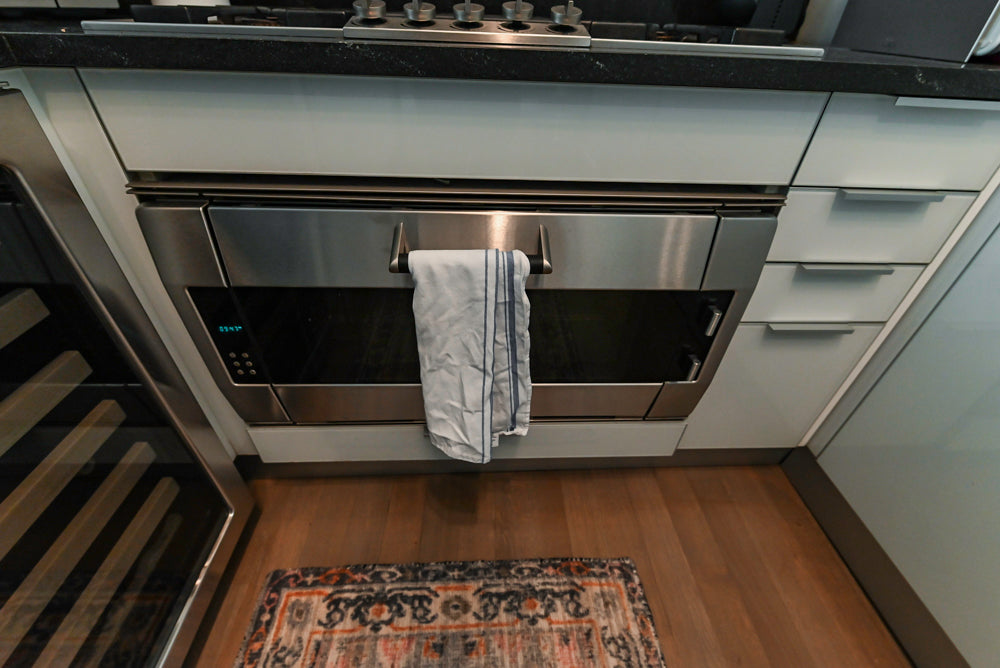 Cesar Modern Glossy White Kitchen with Black Granite Countertops & Appliances