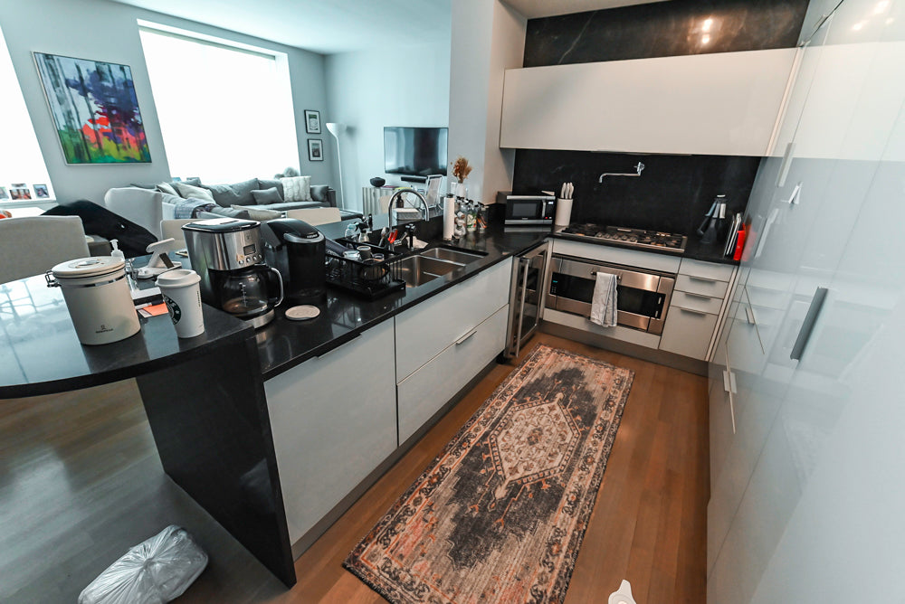 Cesar Modern Glossy White Kitchen with Black Granite Countertops & Appliances