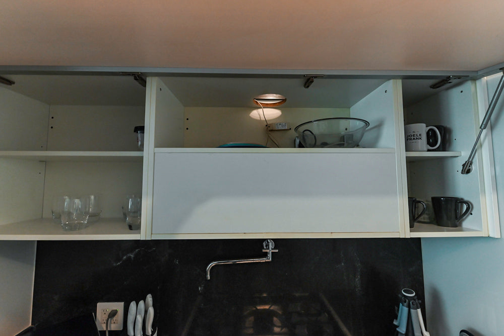 Cesar Modern Glossy White Kitchen with Black Granite Countertops & Appliances