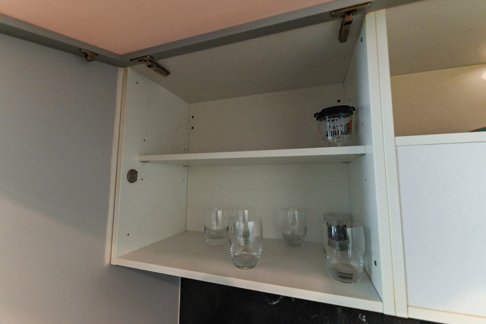 Cesar Modern Glossy White Kitchen with Black Granite Countertops & Appliances