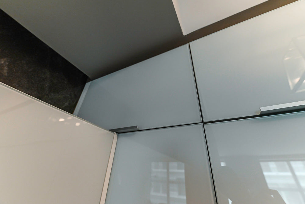 Cesar Modern Glossy White Kitchen with Black Granite Countertops & Appliances