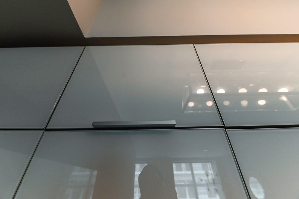 Cesar Modern Glossy White Kitchen with Black Granite Countertops & Appliances