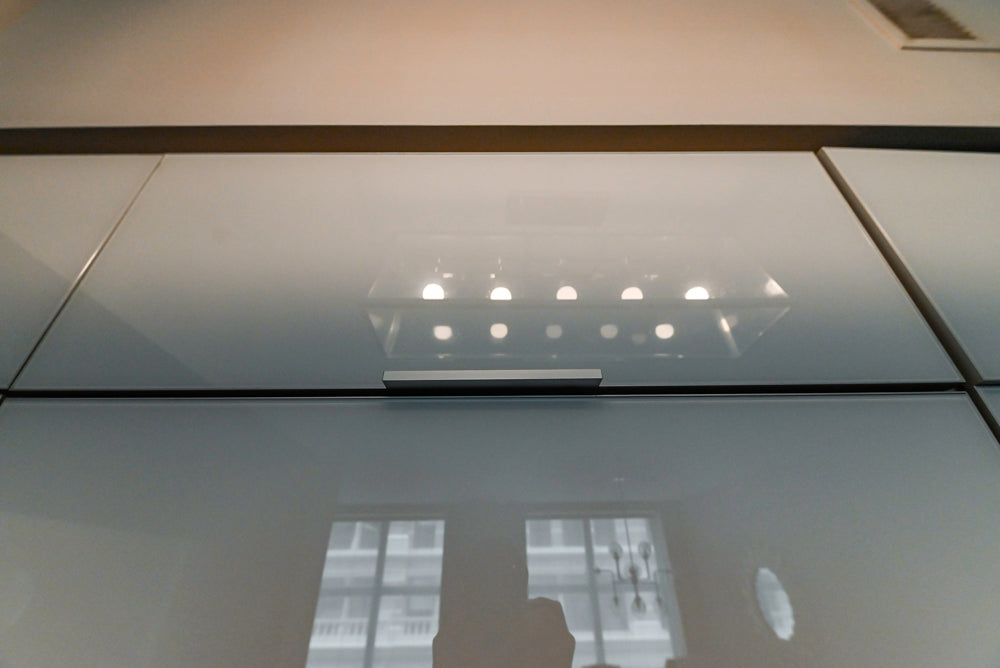 Cesar Modern Glossy White Kitchen with Black Granite Countertops & Appliances