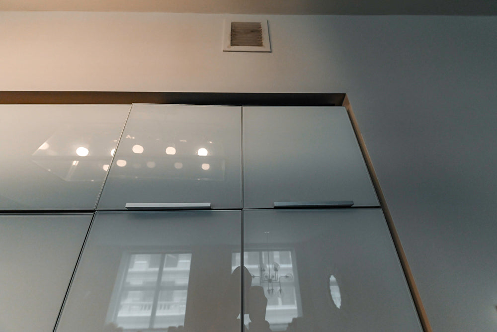 Cesar Modern Glossy White Kitchen with Black Granite Countertops & Appliances