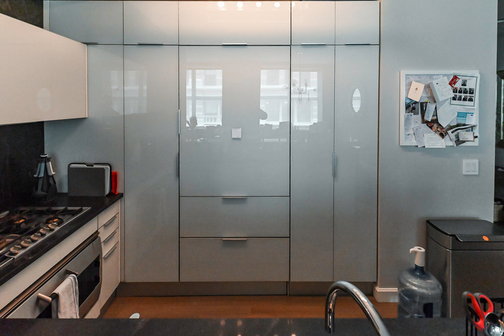 Cesar Modern Glossy White Kitchen with Black Granite Countertops & Appliances