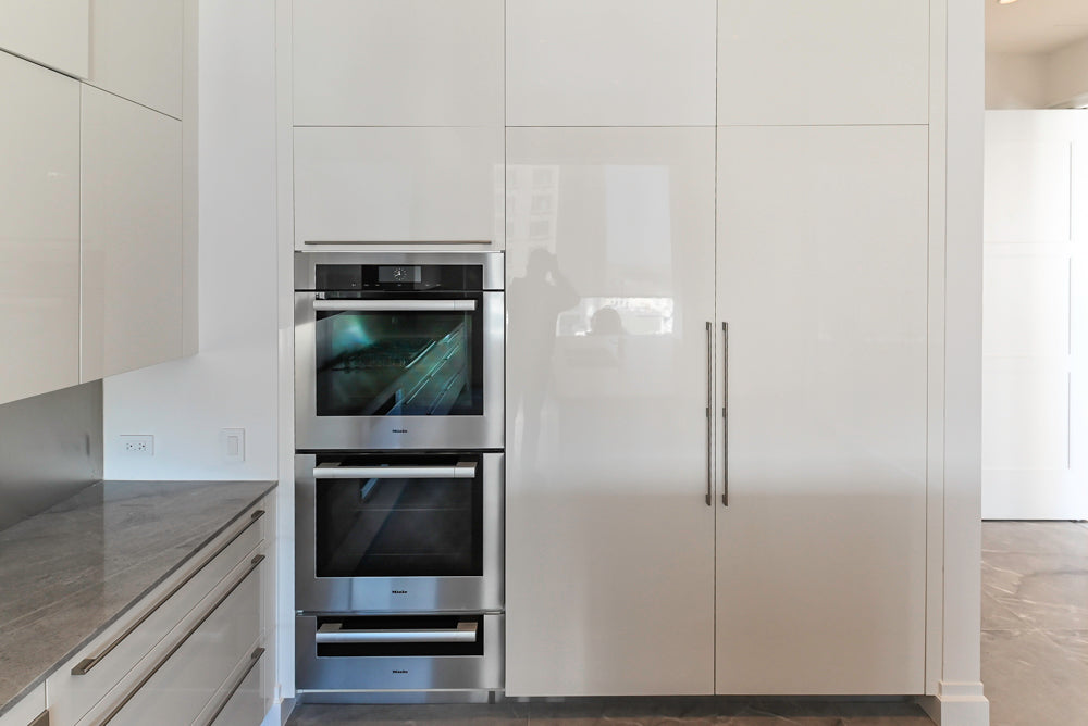 Modern Glossy White Kitchen with Island, Marble Countertops & Miele Appliances