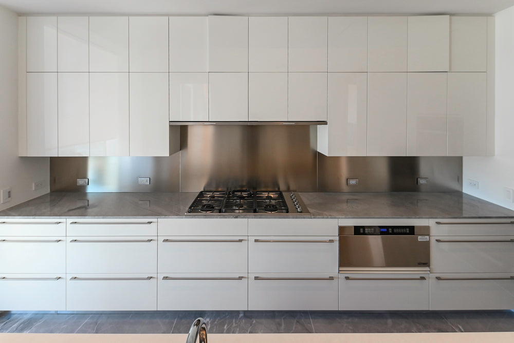 Modern Glossy White Kitchen with Island, Marble Countertops & Miele Appliances