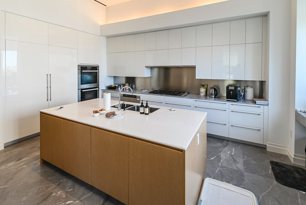 Modern Glossy White Kitchen with Island, Marble Countertops & Miele Appliances