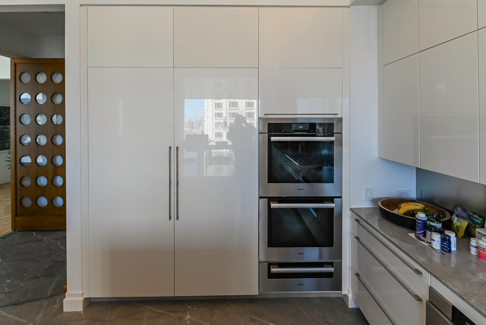 Modern Glossy White Kitchen with Island, Marble Countertops & Miele Appliances