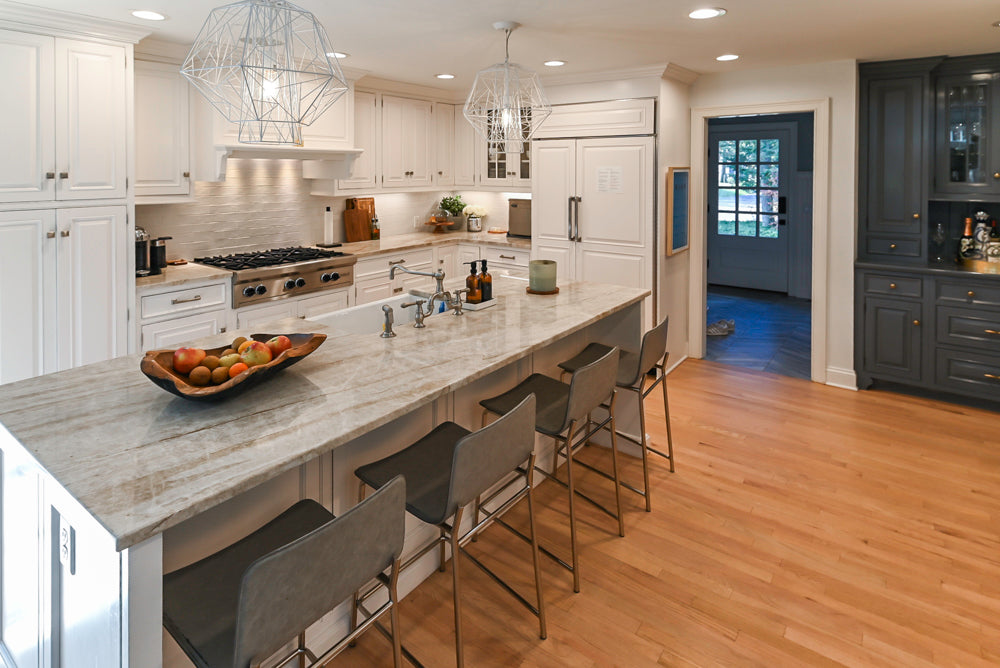 Traditional White Kitchen with Island, Appliances and Marble Countertops