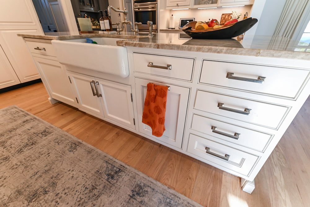 Traditional White Kitchen with Island, Appliances and Marble Countertops