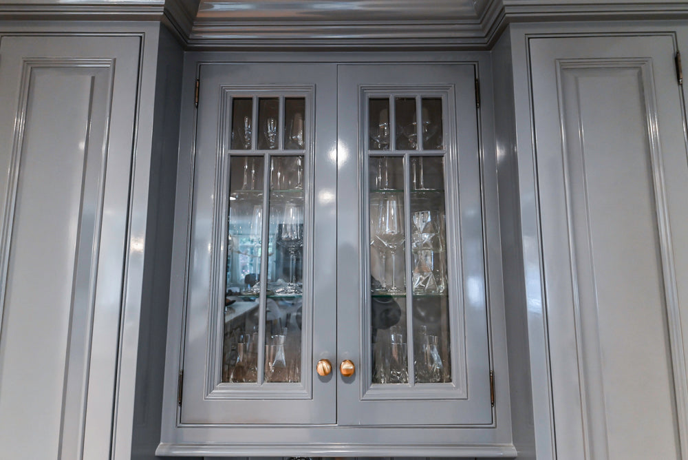 Traditional White Kitchen with Island, Appliances and Marble Countertops