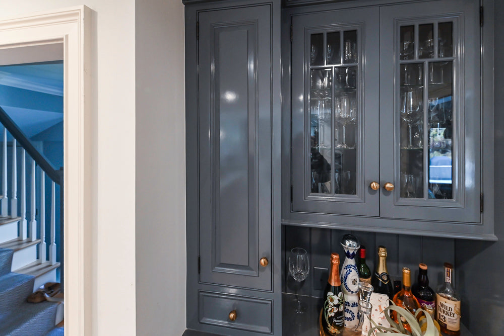 Traditional White Kitchen with Island, Appliances and Marble Countertops