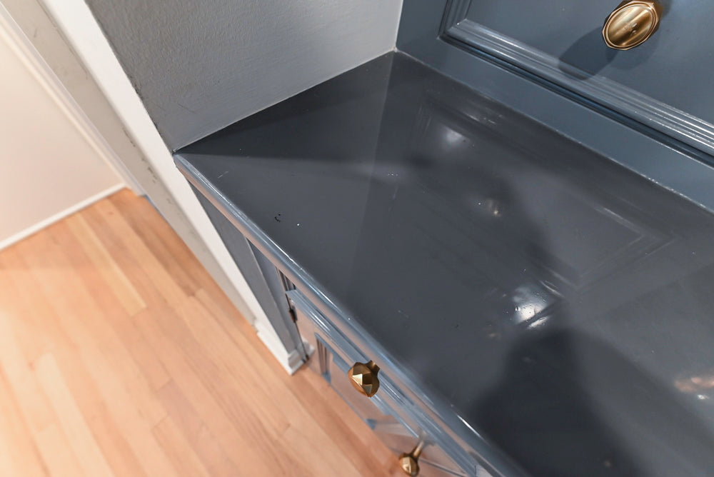 Traditional White Kitchen with Island, Appliances and Marble Countertops