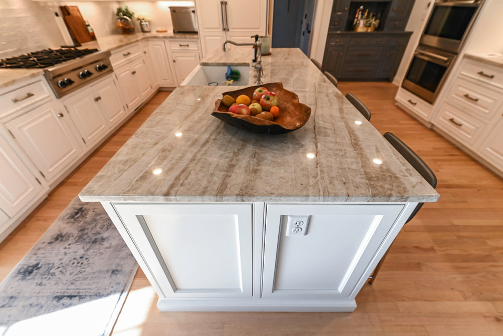 Traditional White Kitchen with Island, Appliances and Marble Countertops