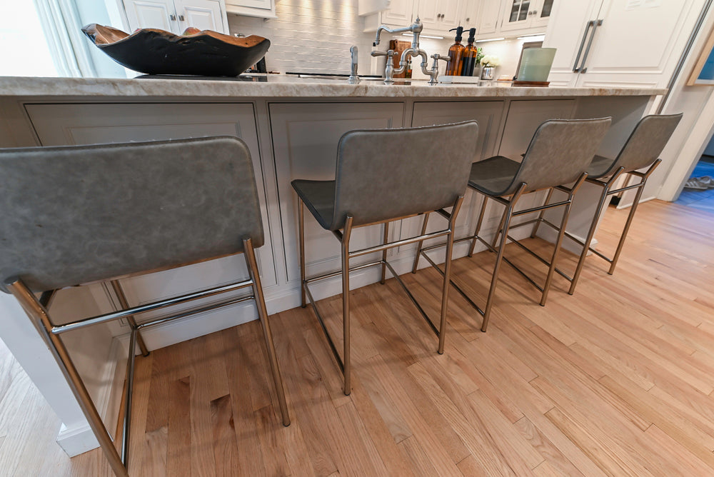 Traditional White Kitchen with Island, Appliances and Marble Countertops