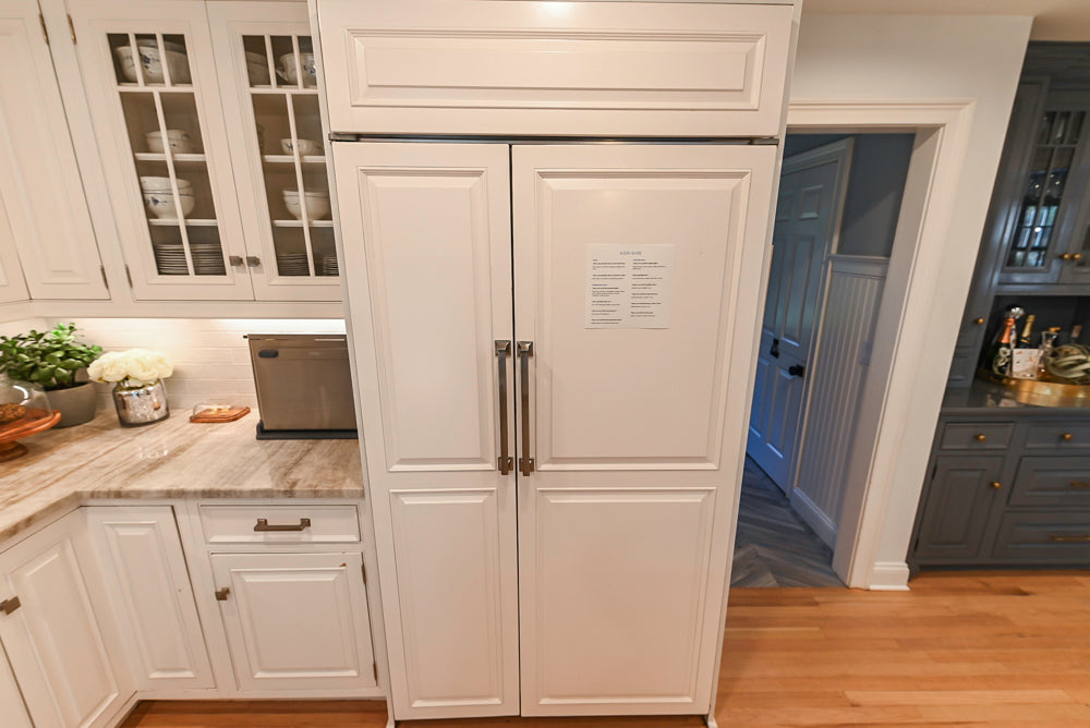 Traditional White Kitchen with Island, Appliances and Marble Countertops