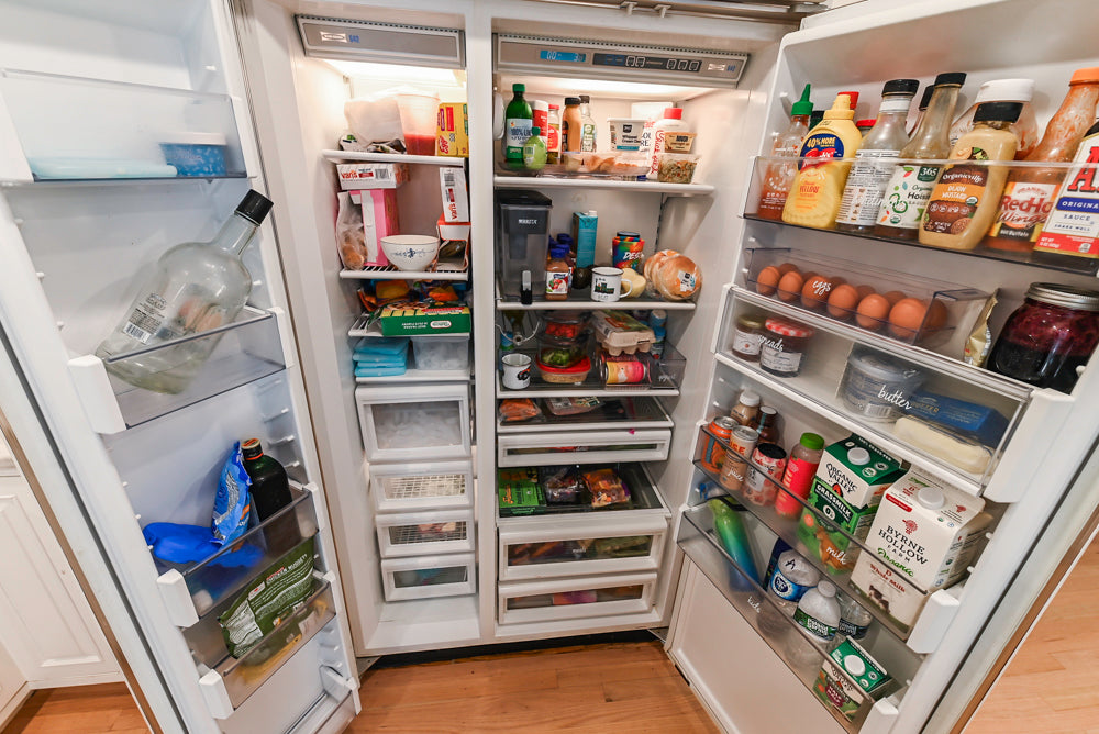 Traditional White Kitchen with Island, Appliances and Marble Countertops