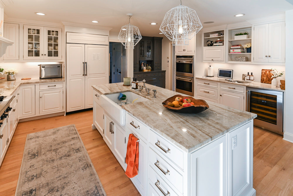 Traditional White Kitchen with Island, Appliances and Marble Countertops
