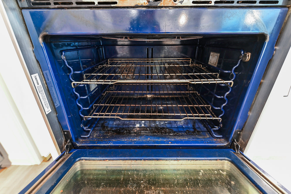 Traditional White Kitchen with Island, Appliances and Marble Countertops