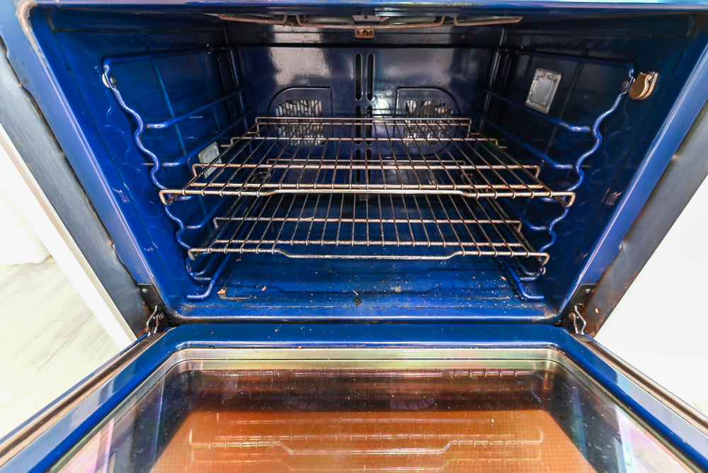 Traditional White Kitchen with Island, Appliances and Marble Countertops