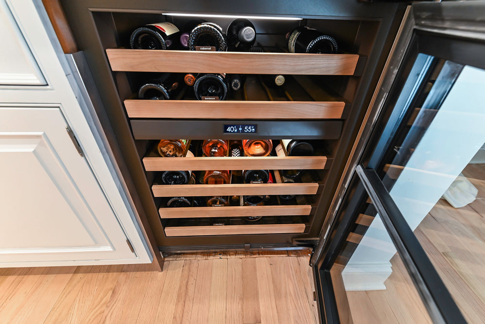 Traditional White Kitchen with Island, Appliances and Marble Countertops