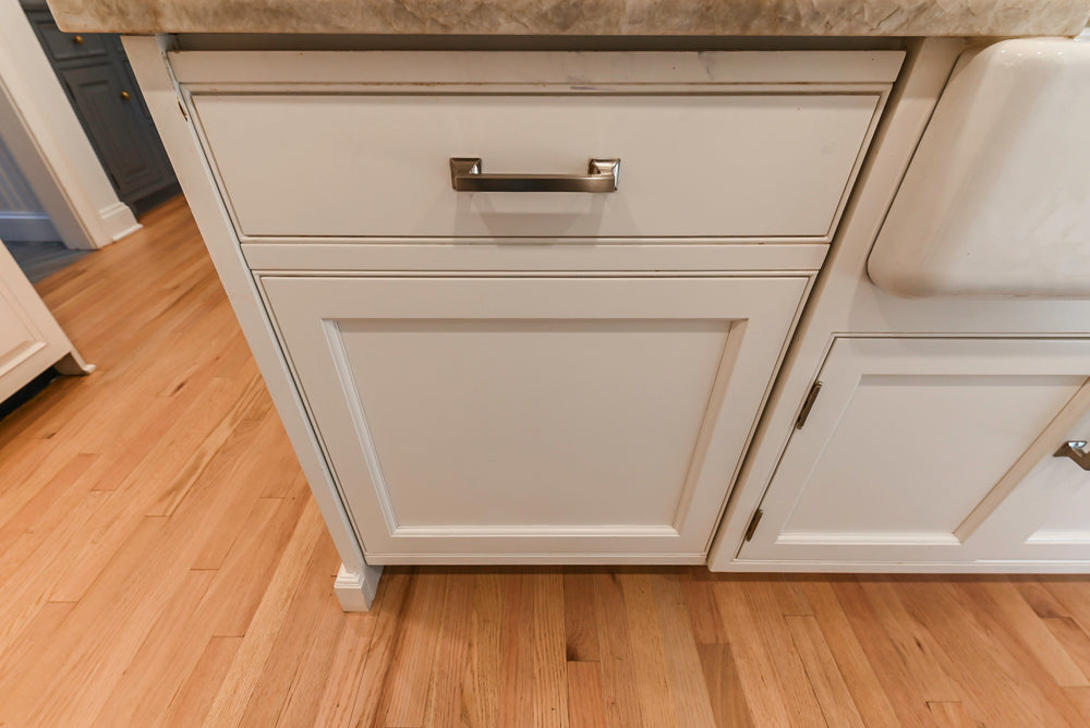 Traditional White Kitchen with Island, Appliances and Marble Countertops