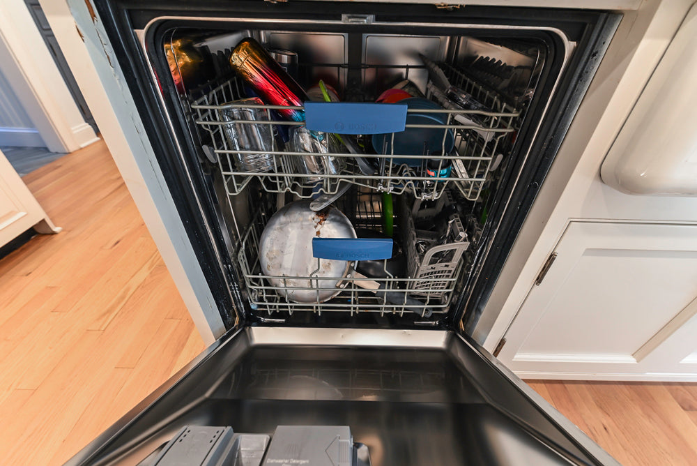 Traditional White Kitchen with Island, Appliances and Marble Countertops