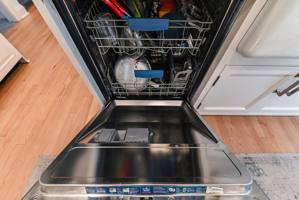 Traditional White Kitchen with Island, Appliances and Marble Countertops