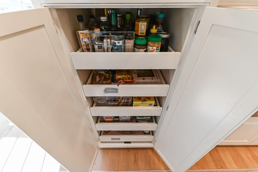 Traditional White Kitchen with Island, Appliances and Marble Countertops