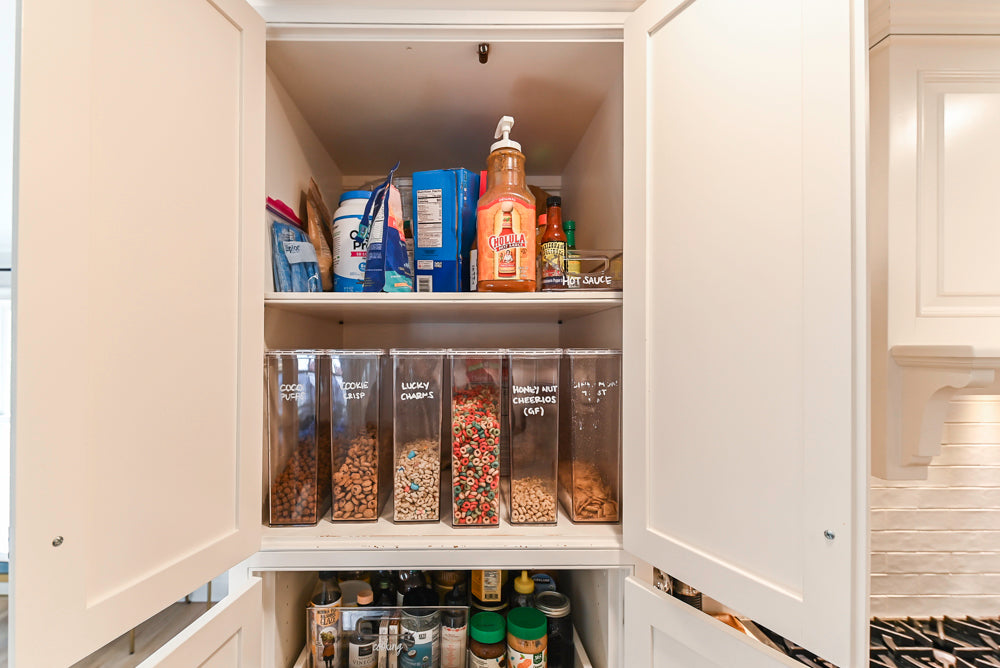 Traditional White Kitchen with Island, Appliances and Marble Countertops