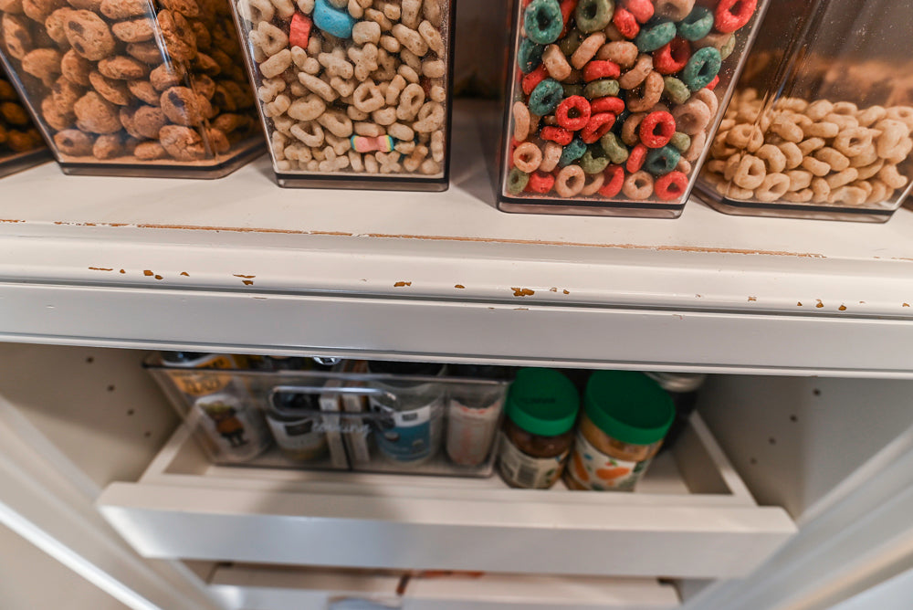 Traditional White Kitchen with Island, Appliances and Marble Countertops