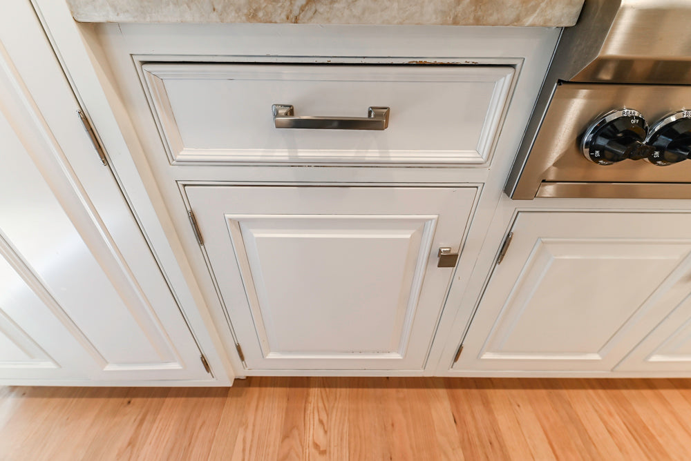 Traditional White Kitchen with Island, Appliances and Marble Countertops