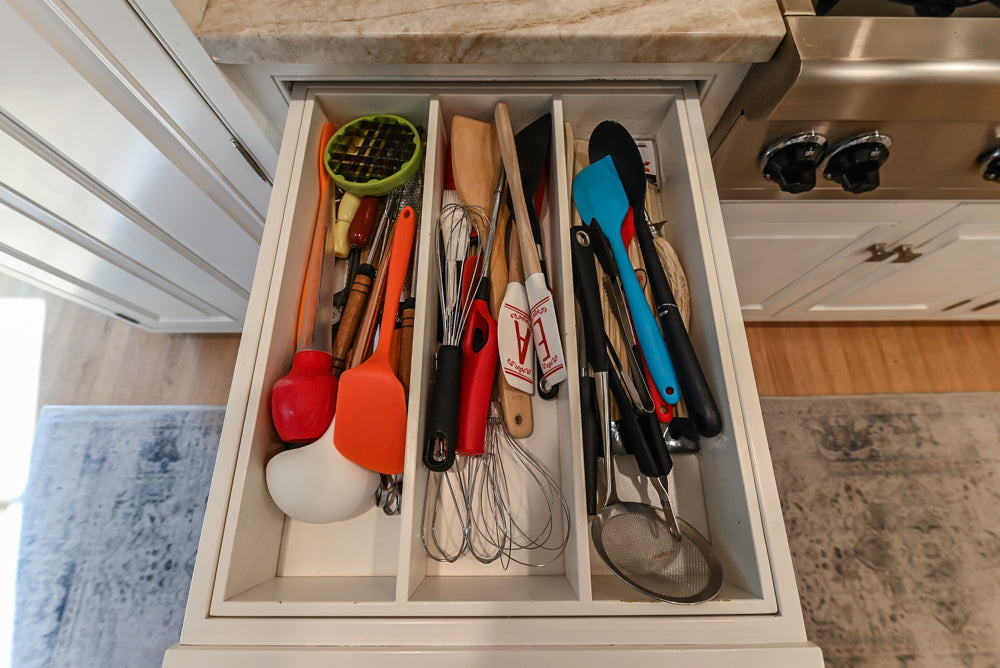 Traditional White Kitchen with Island, Appliances and Marble Countertops