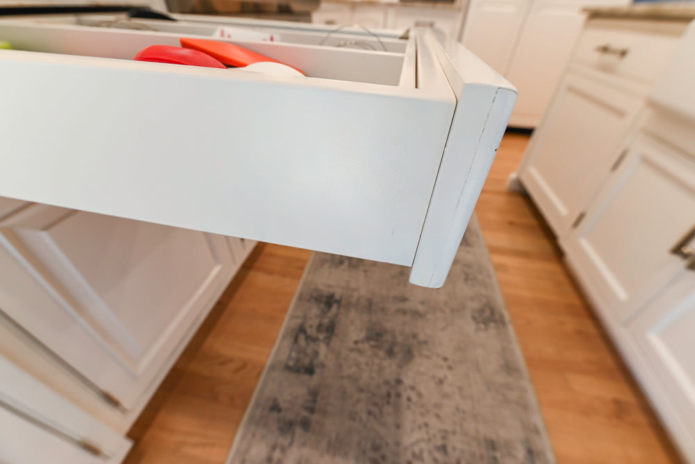 Traditional White Kitchen with Island, Appliances and Marble Countertops