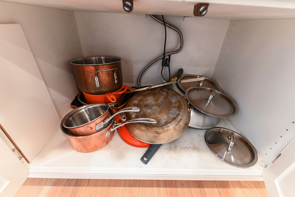 Traditional White Kitchen with Island, Appliances and Marble Countertops