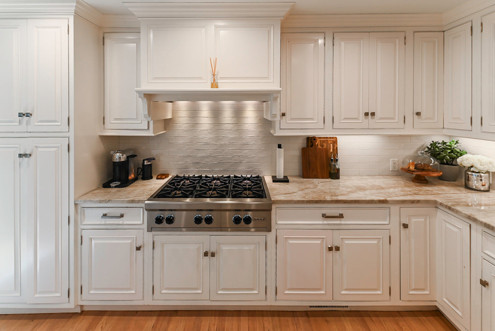 Traditional White Kitchen with Island, Appliances and Marble Countertops