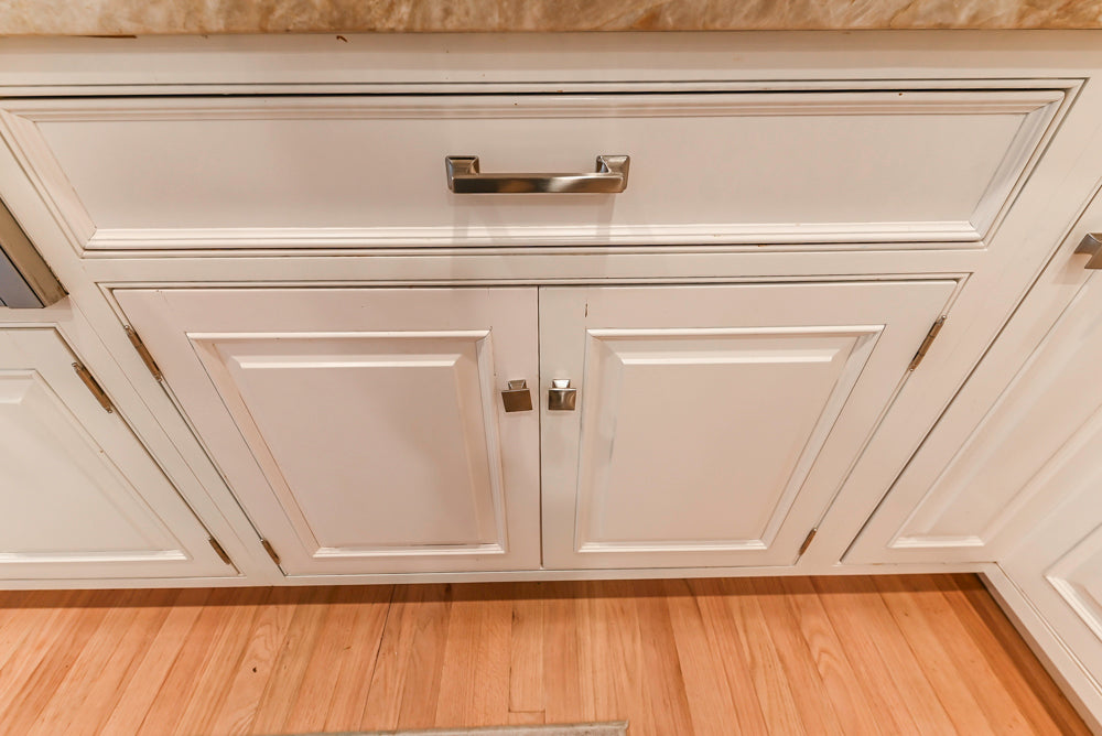 Traditional White Kitchen with Island, Appliances and Marble Countertops