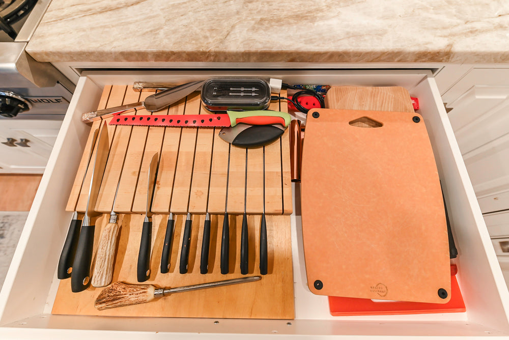 Traditional White Kitchen with Island, Appliances and Marble Countertops