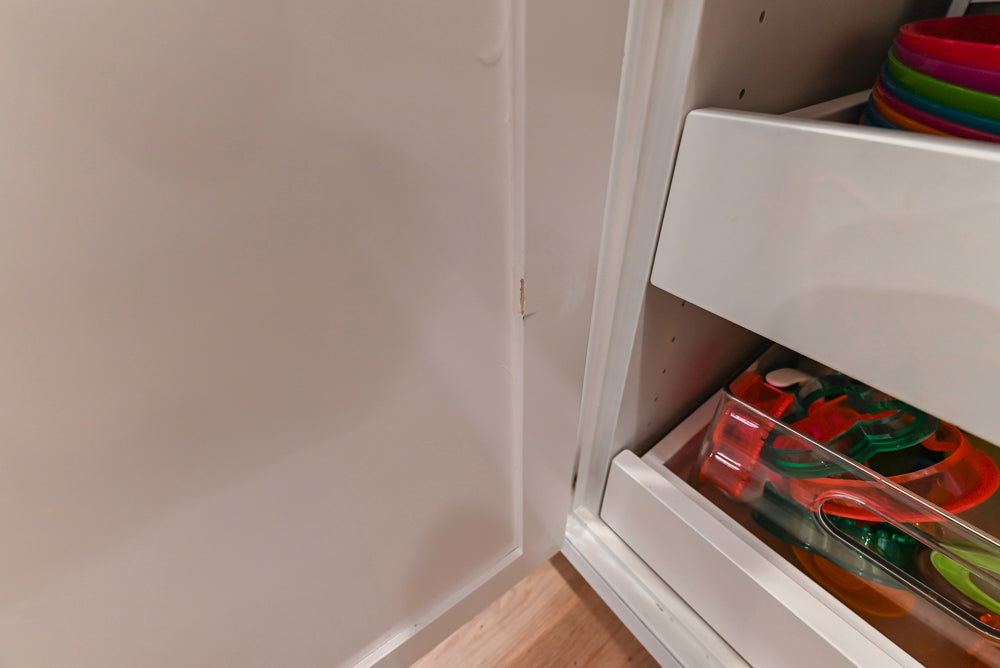 Traditional White Kitchen with Island, Appliances and Marble Countertops